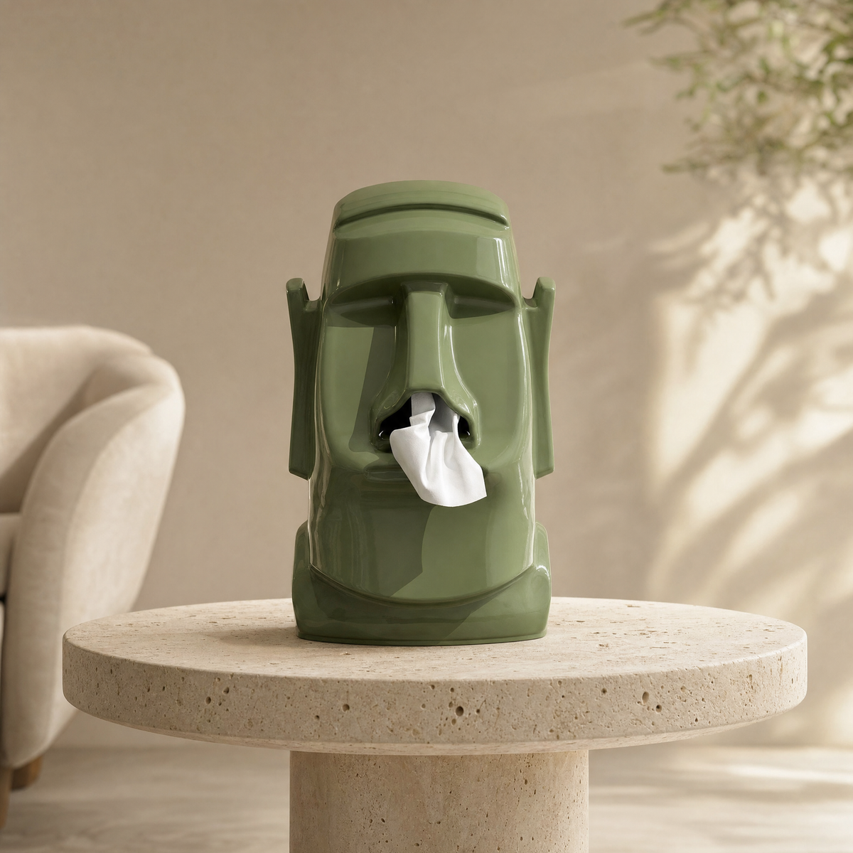 Tissue box stone figure in green on a travertine side table